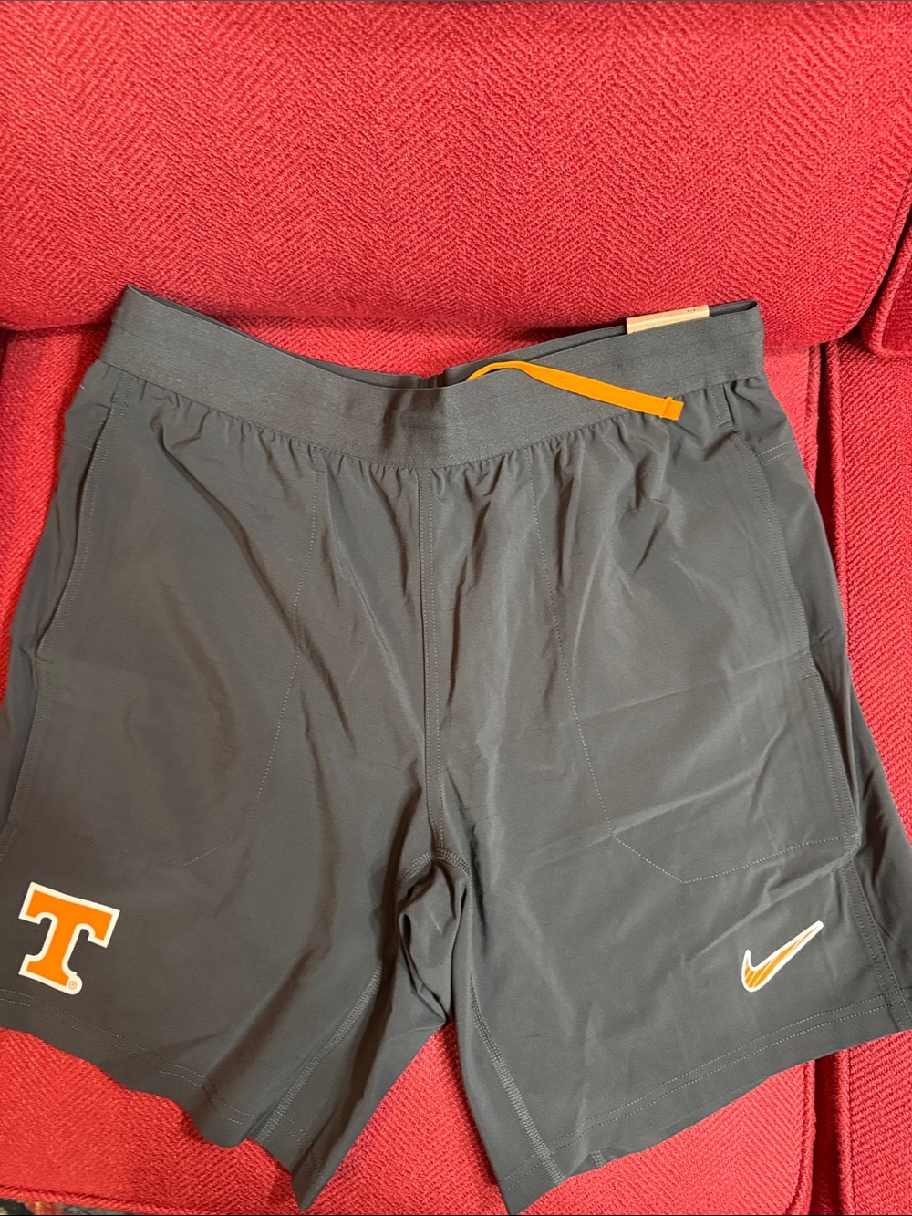 Nike Gray Men’s Athletic Shorts with Orange Accents